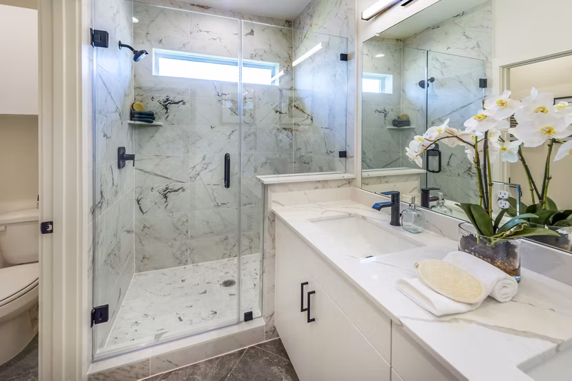 Modern bathroom featuring sleek fixtures and spacious layout at Eden at Sunterra Apartments in Texas