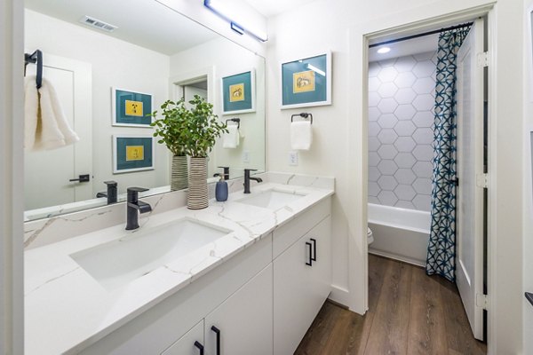 Bathroom featuring sleek modern fixtures at Eden at Sunterra Apartments