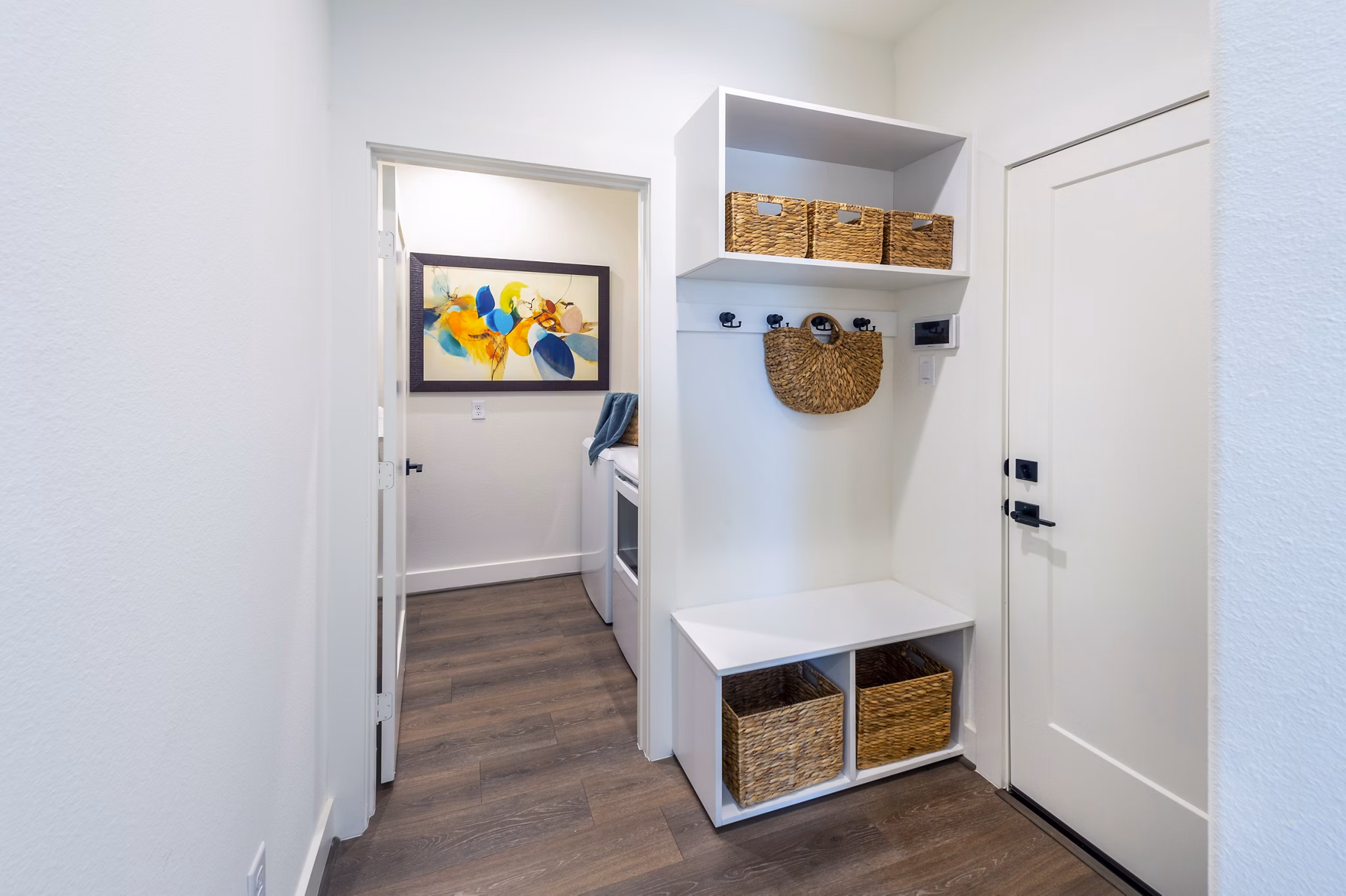 Eden at Sunterra: Elegant entryway of luxury apartments in a serene setting