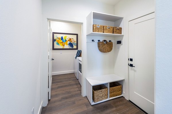 Eden at Sunterra: Elegant entryway of luxury apartments in a serene setting