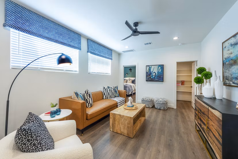 Modern living room with stylish decor at Eden at Sunterra Apartments