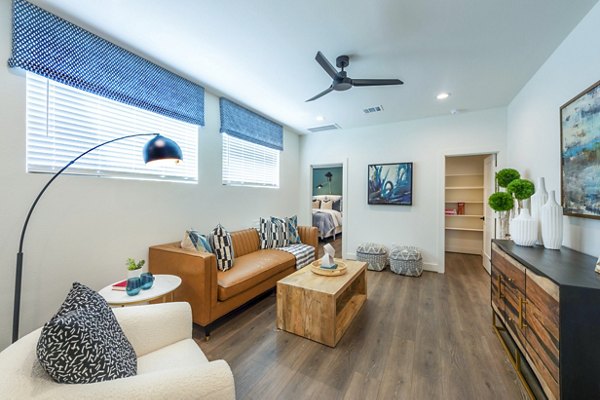 Modern living room with stylish decor at Eden at Sunterra Apartments