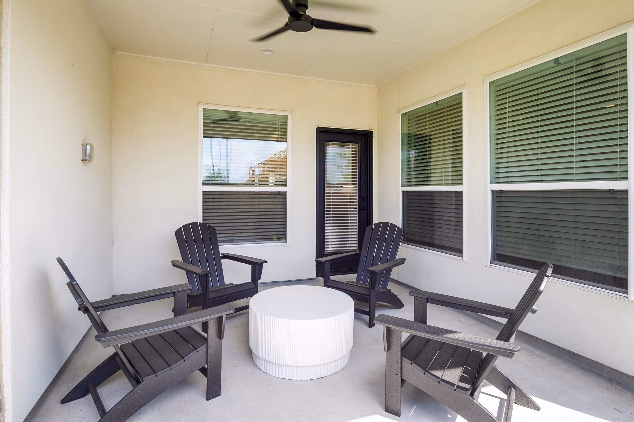 Modern outdoor patio with seating at Eden at Sunterra luxury apartments
