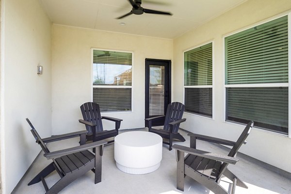Modern outdoor patio with seating at Eden at Sunterra luxury apartments