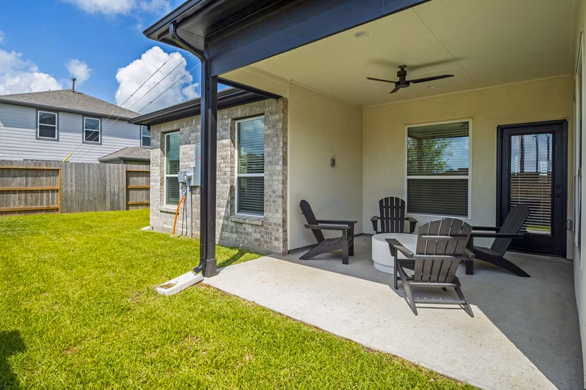 Eden at Sunterra: Elegant patio area with stylish outdoor furniture in luxury apartment community