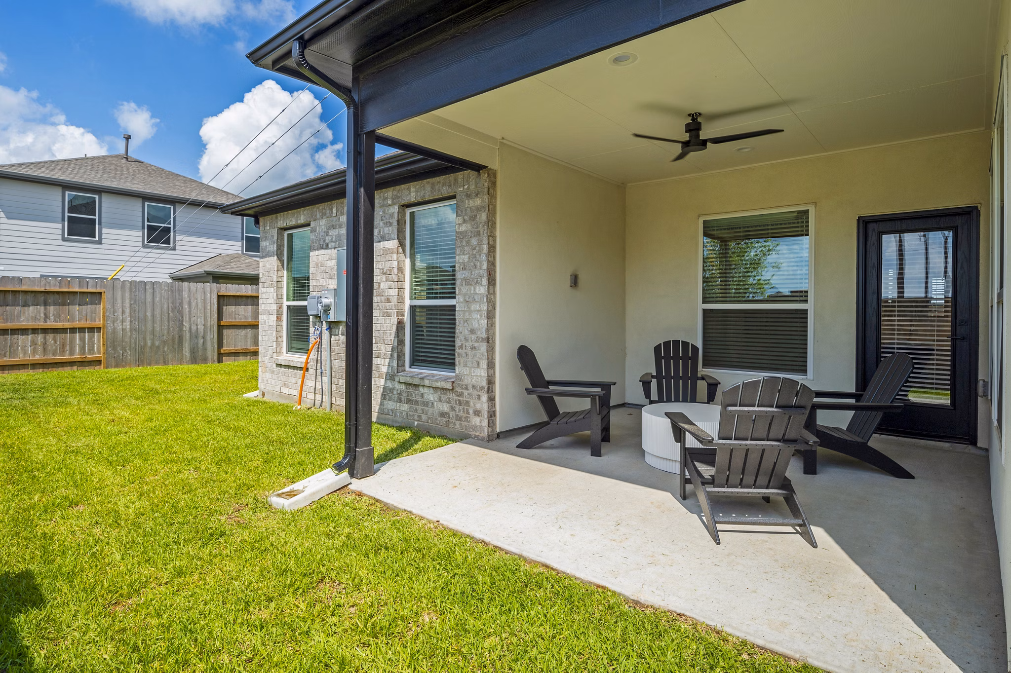 Eden at Sunterra: Elegant patio area with stylish outdoor furniture in luxury apartment community