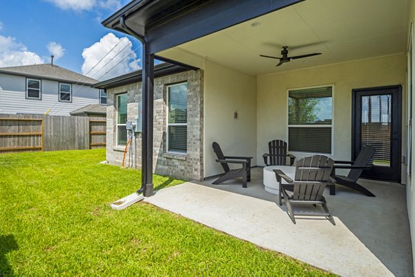 Eden at Sunterra: Elegant patio area with stylish outdoor furniture in luxury apartment community