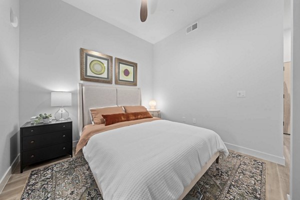 Cozy bedroom with elegant decor at The Monde Scottsdale Apartments