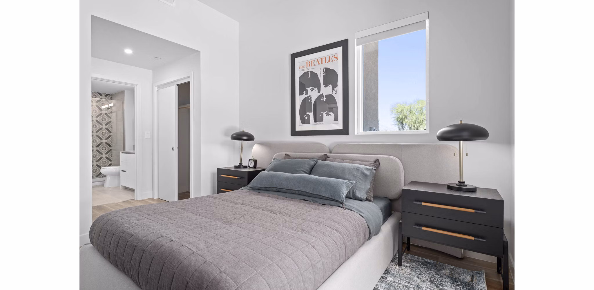 The Monde Scottsdale Apartments: Elegant bedroom with chic decor and natural light