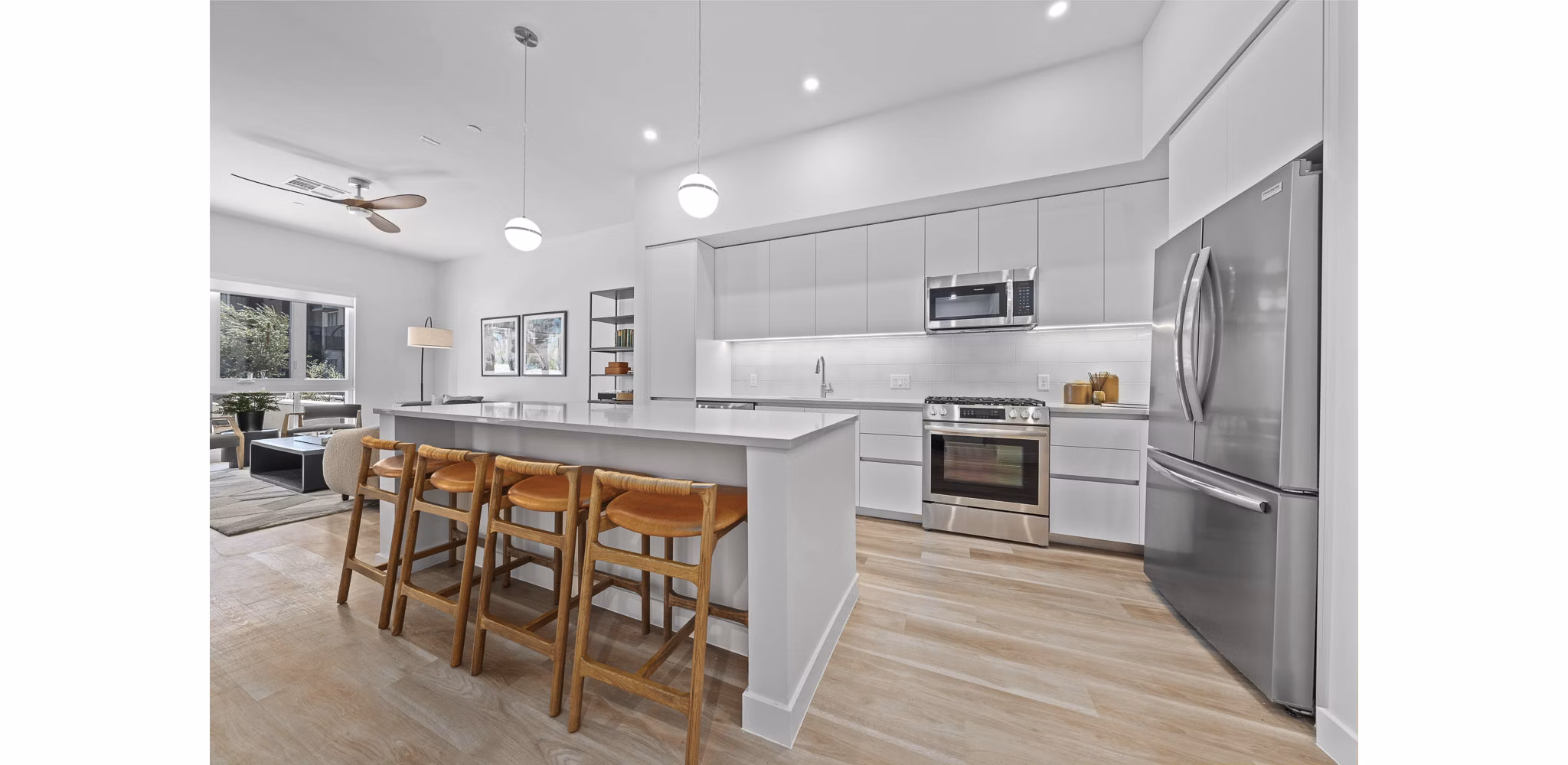 Modern kitchen with sleek countertops and stainless-steel appliances at The Monde Scottsdale Apartments