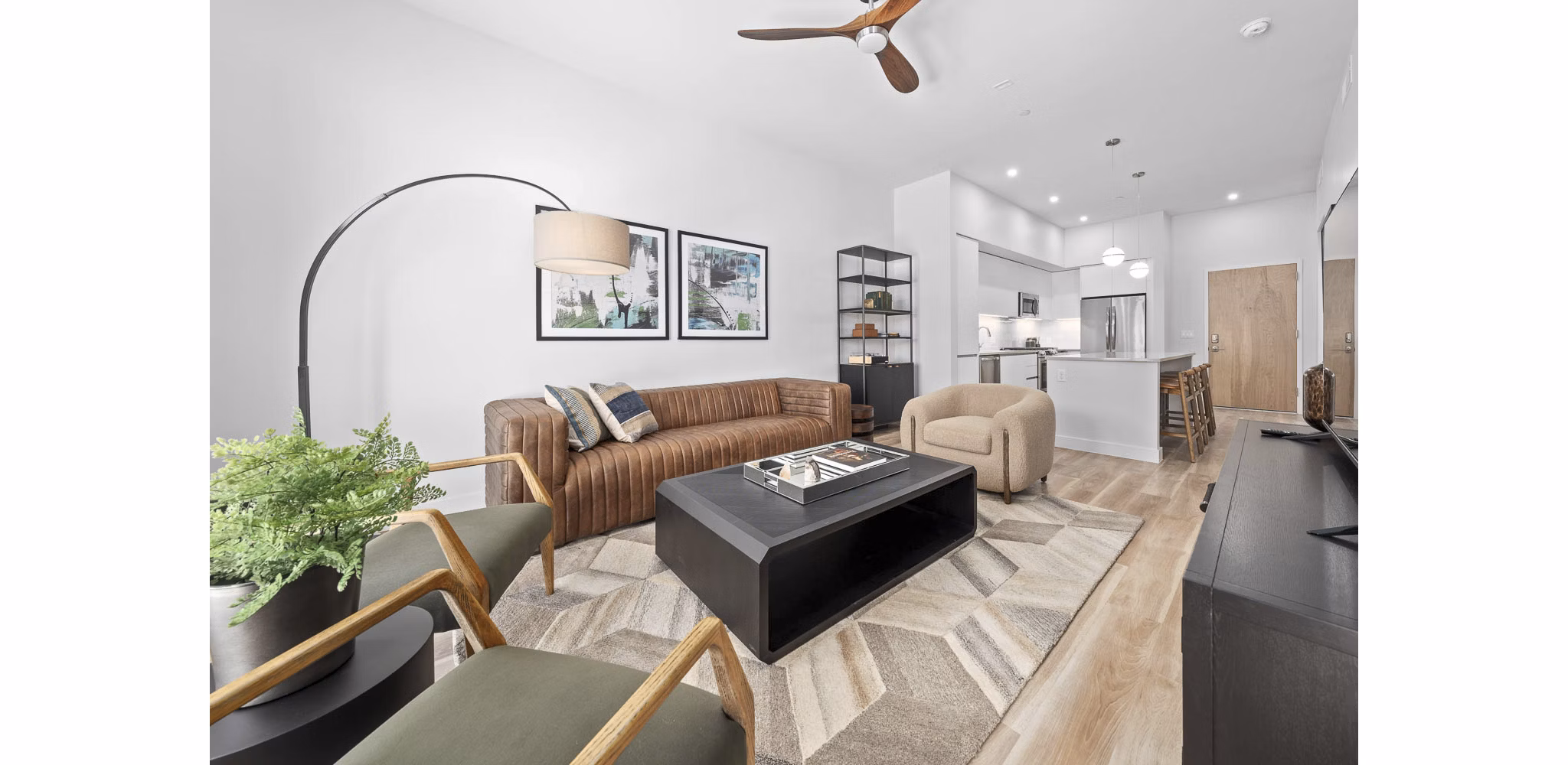Spacious living room with modern decor in The Monde Scottsdale Apartments