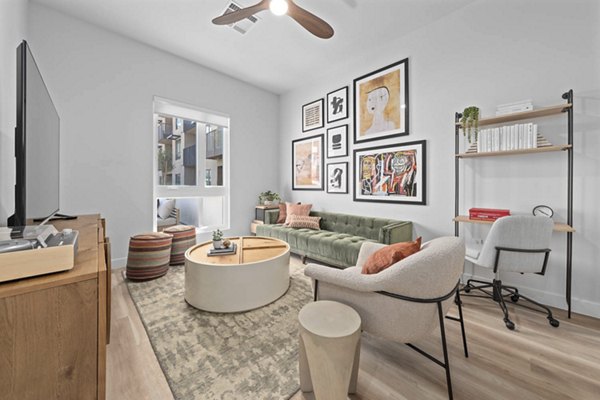 Open-concept living room with modern decor at The Monde Scottsdale Apartments