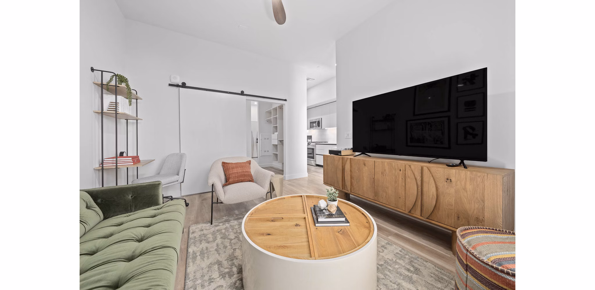 Spacious living room with modern decor and large windows at The Monde Scottsdale Apartments