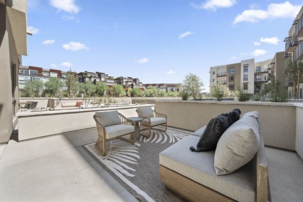 Stylish patio area with modern furnishings at The Monde Scottsdale Apartments, ideal for outdoor relaxation and social gatherings