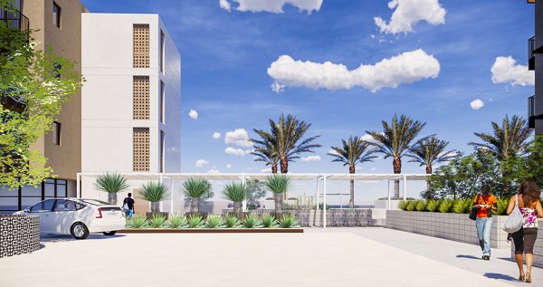 Outdoor swimming pool area with lounge chairs and a luxury apartment building in the background