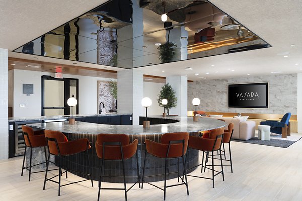 Clubhouse featuring modern design and large seating area at Vasara Apartments