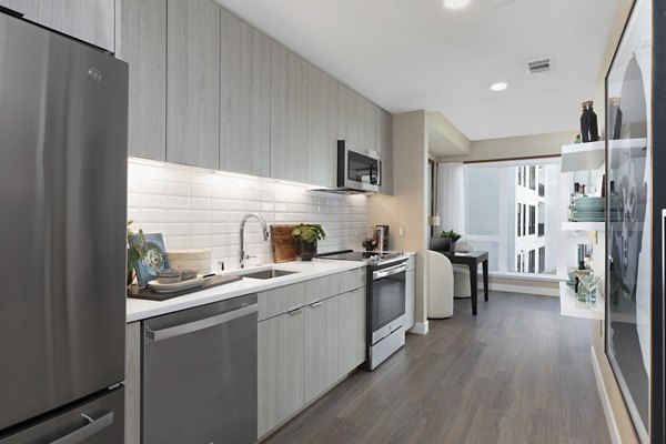 Vasara Apartments: Modern kitchen with sleek countertops and stainless steel appliances