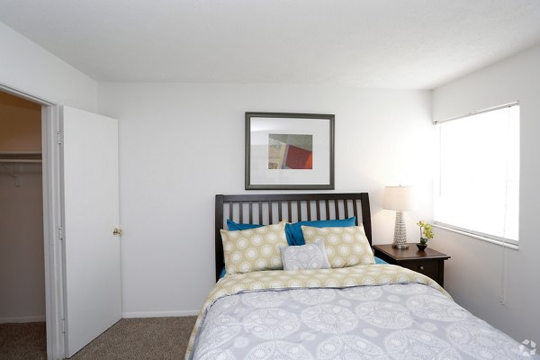 Cozy bedroom with modern furnishings in The M Club Apartments
