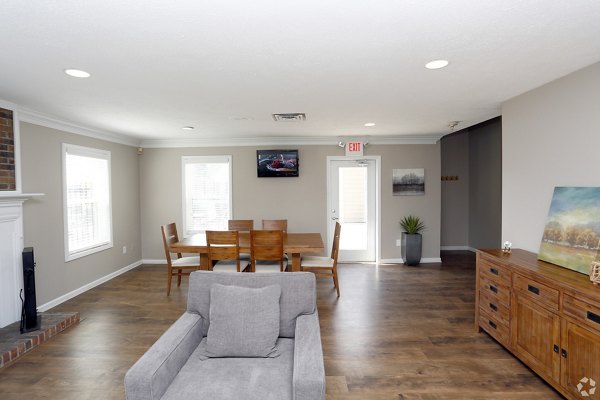 The M Club Apartments: Stylish clubhouse with modern seating and entertainment options