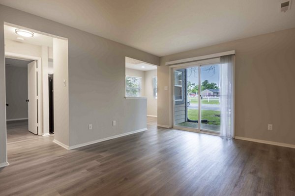 Spacious open-plan kitchen with modern appliances in The M Club Apartments