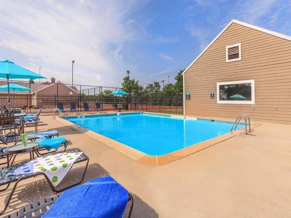 Poolside relaxation at The M Club Apartments featuring luxury amenities and stylish design