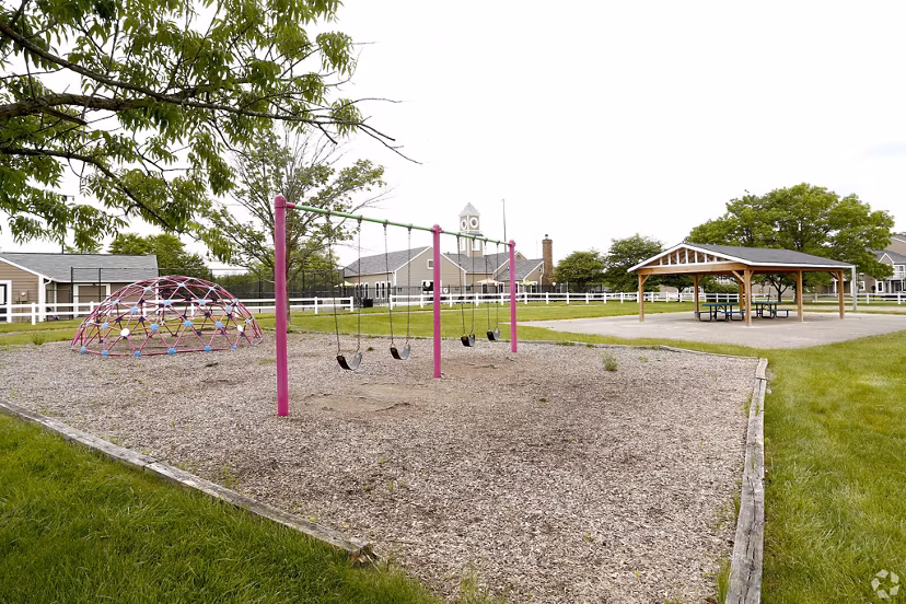 Playground with modern equipment at The M Club Apartments for family-friendly outdoor fun