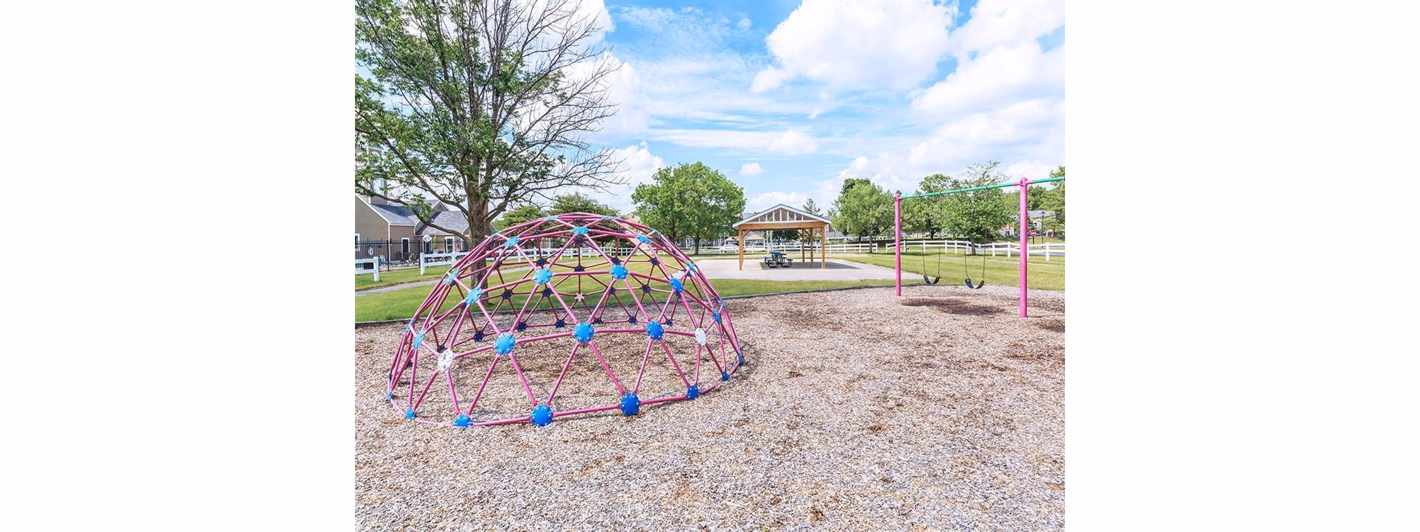 Playground at The M Club Apartments: Modern play area with safe equipment for resident children