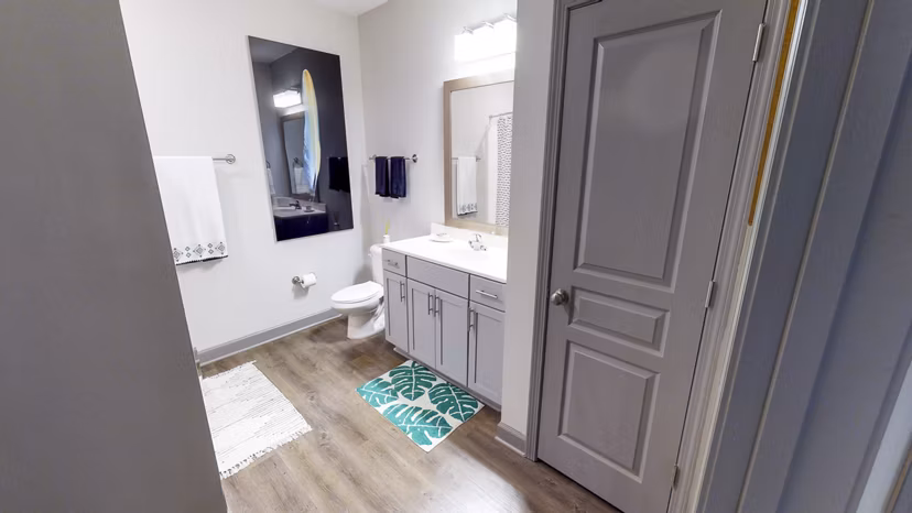 Luxury bathroom with elegant marble finishes in Indigo at Cross Creek Apartments
