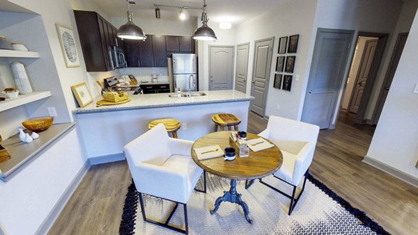 Elegant dining room with modern dÃ©cor at Indigo at Cross Creek Apartments offering luxury living