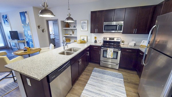 Modern kitchen with sleek cabinetry and stainless steel appliances at Indigo at Cross Creek Apartments