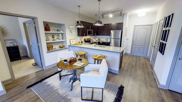 Modern kitchen with stainless steel appliances at Indigo at Cross Creek Apartments