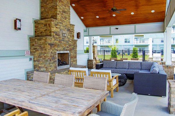 Fire pit with comfortable seating on the patio at Indigo at Cross Creek Apartments