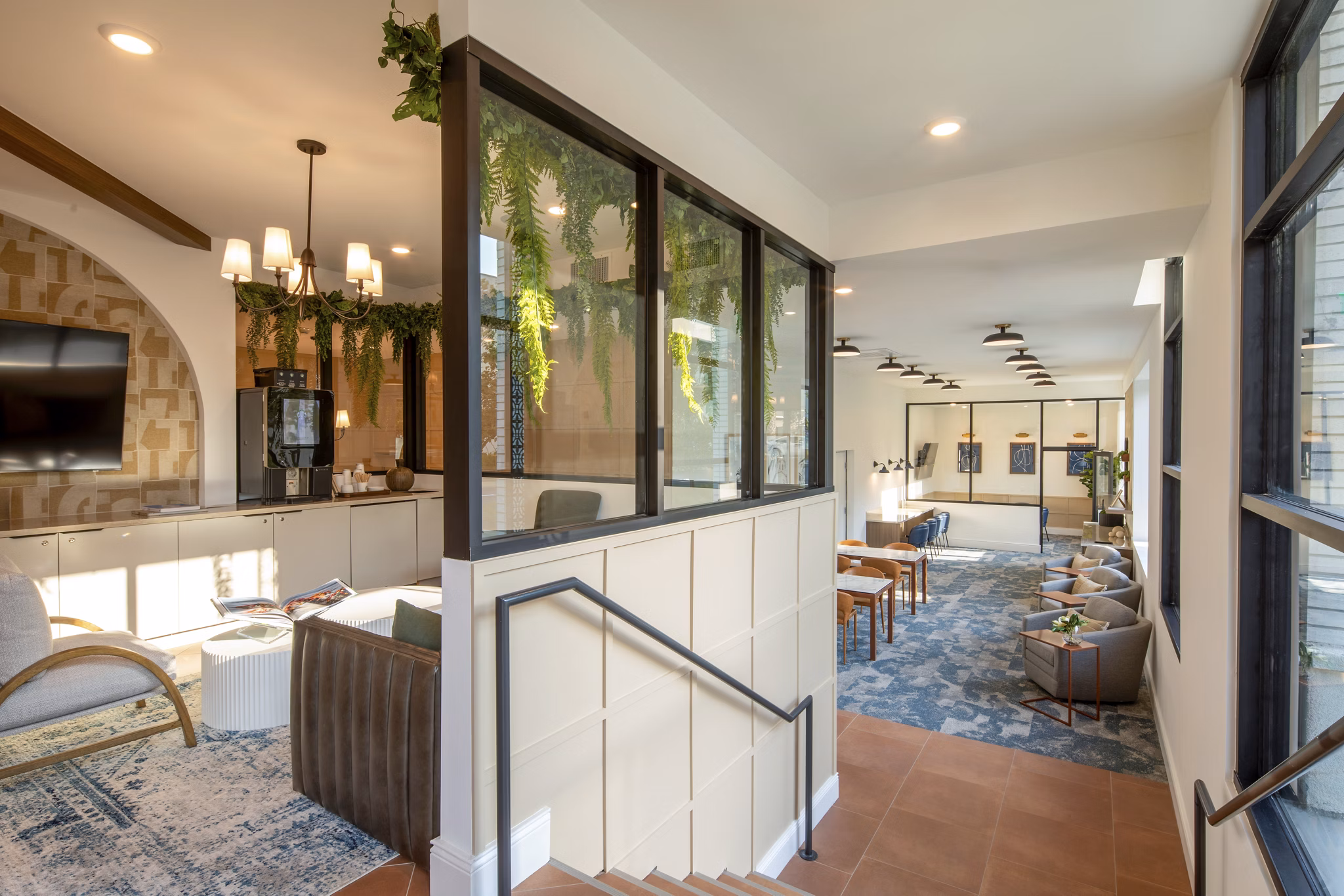 Clubhouse featuring modern decor and spacious seating at Lumia Apartments in Greystar community