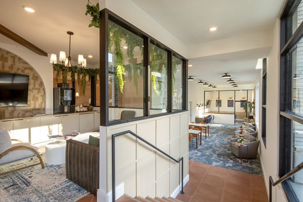 Clubhouse featuring modern decor and spacious seating at Lumia Apartments in Greystar community