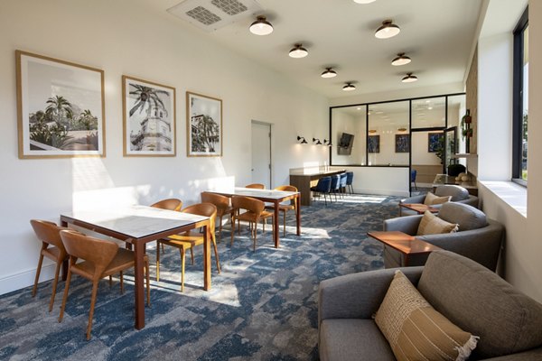 Clubhouse with modern decor and seating at Lumia Apartments in a Greystar luxury community
