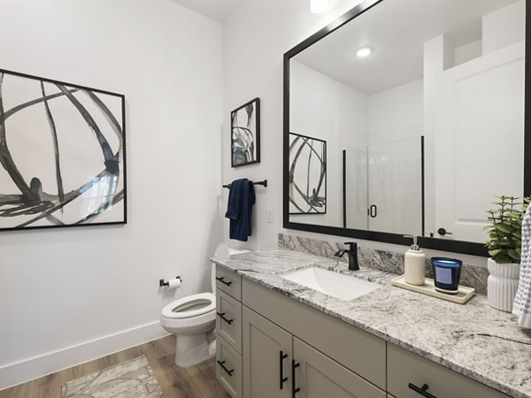 Modern bathroom with sleek fixtures at The Evergrove at Crystal Village Apartments