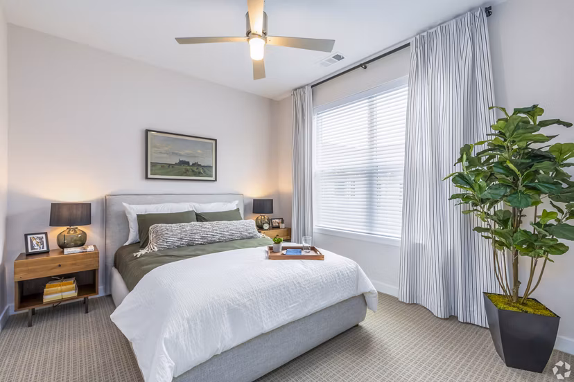 Cozy bedroom with stylish decor in Park 40 Apartments, featuring luxury furnishings and modern design elements
