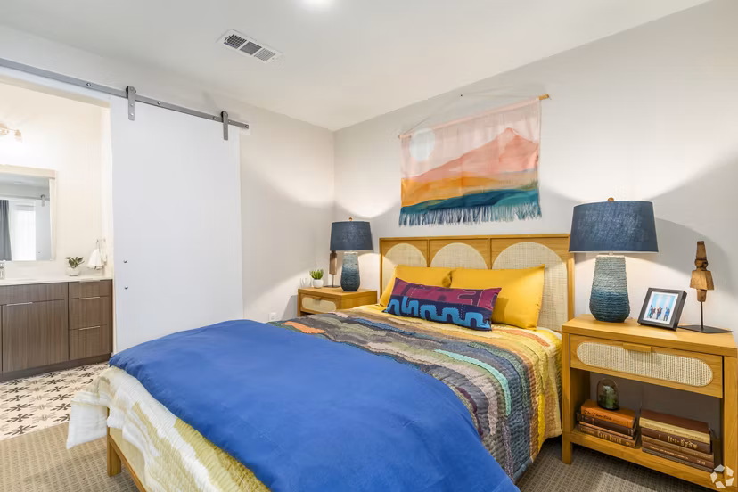 Bedroom with natural lighting and modern furnishings at Park 40 Apartments