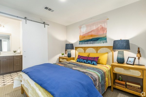 Bedroom with natural lighting and modern furnishings at Park 40 Apartments