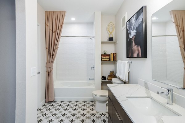 Bathroom with dual sinks and modern fixtures at Park 40 Apartments in Greystar's luxury community