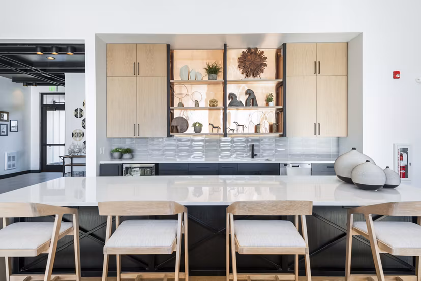 Modern clubhouse with spacious seating and fireplace at Park 40 Apartments, a luxury Greystar community