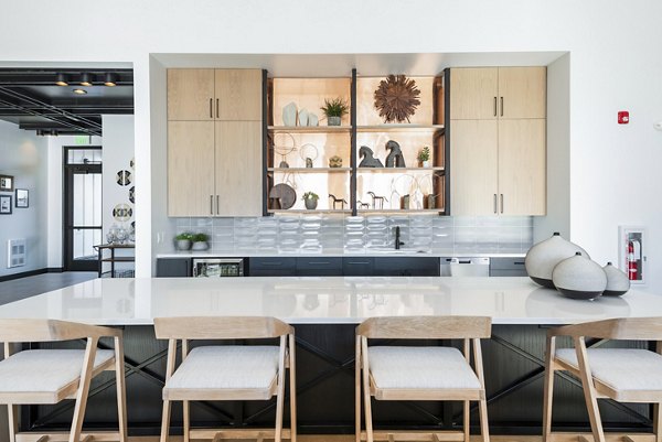 Modern clubhouse with spacious seating and fireplace at Park 40 Apartments, a luxury Greystar community