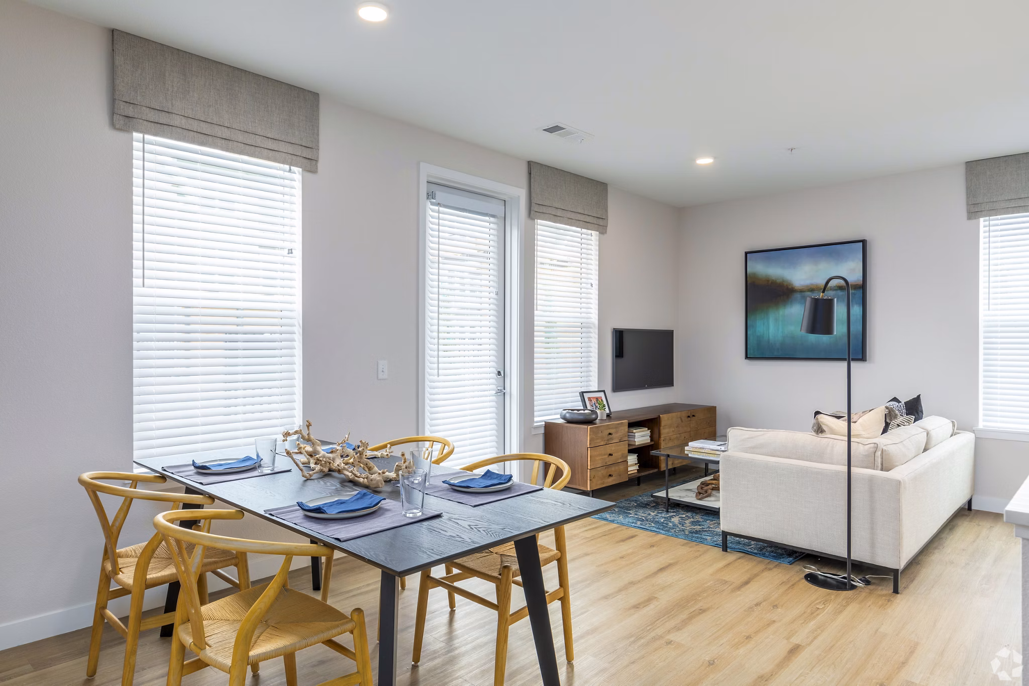 Dining area with modern decor and large windows at Park 40 Apartments