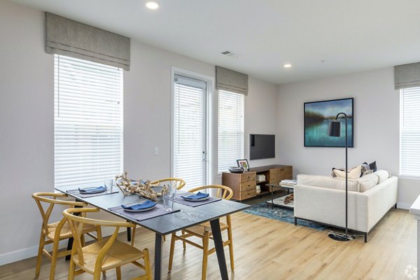 Dining area with modern decor and large windows at Park 40 Apartments