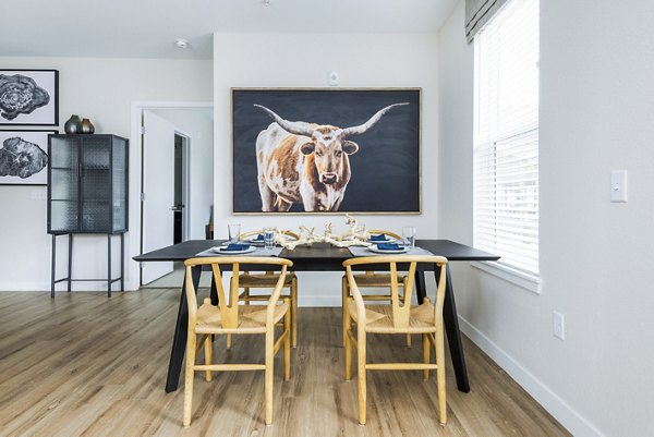 Dining area with modern furnishings and elegant lighting at Park 40 Apartments