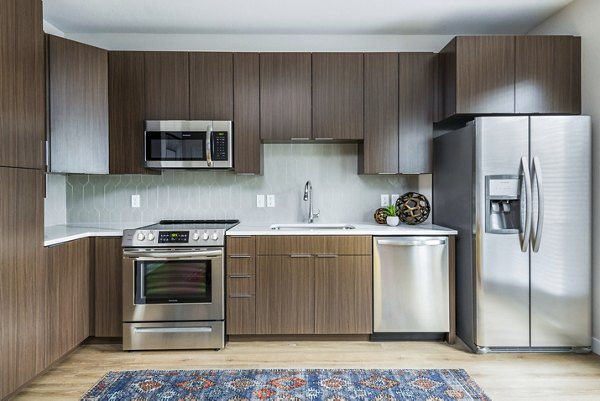 Modern kitchen with stainless steel appliances at Park 40 Apartments