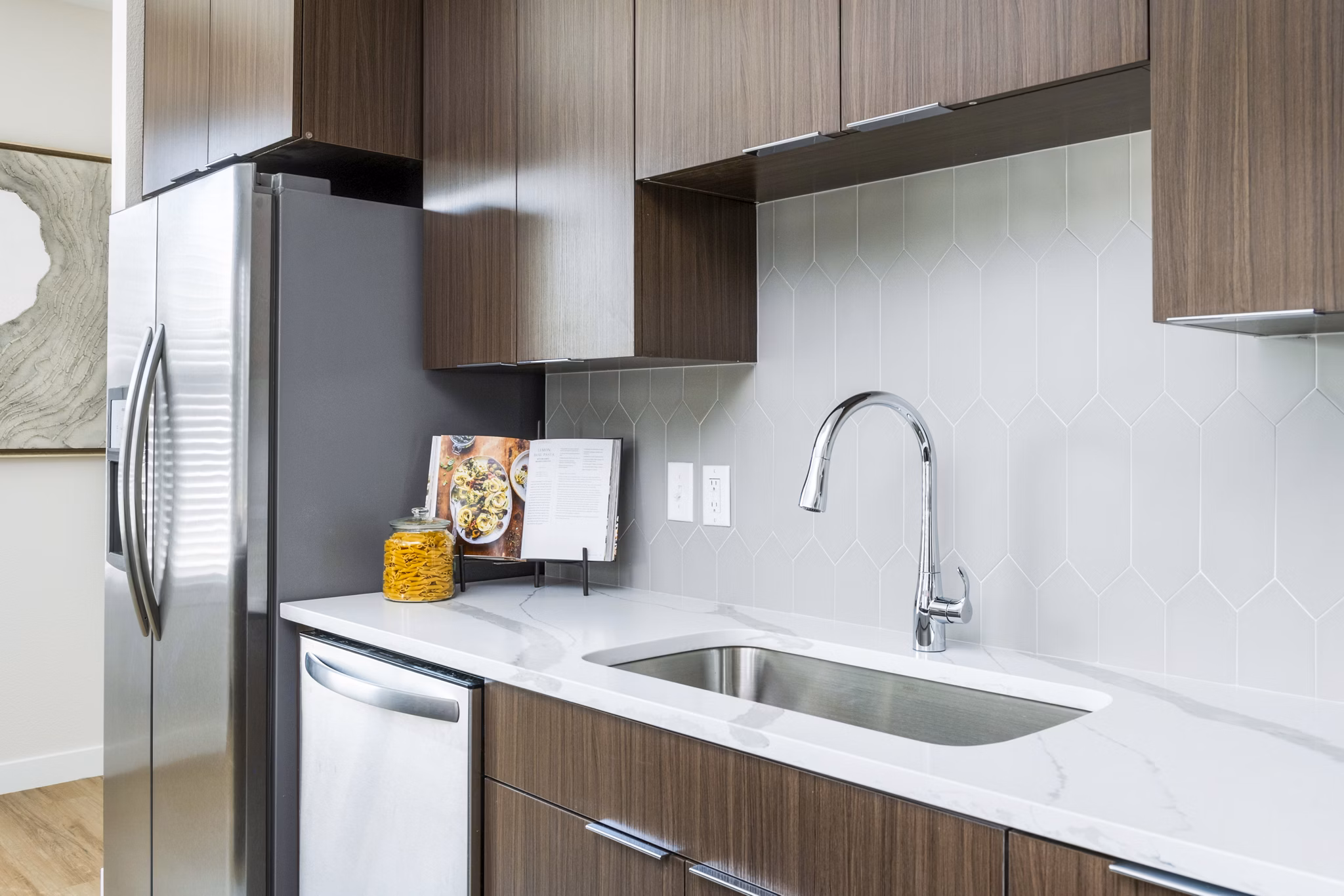 Modern kitchen featuring stainless steel appliances and granite countertops in Park 40 Apartments, a luxury Greystar community