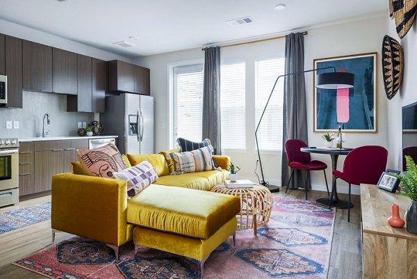 Spacious living room with contemporary decor and ample seating in Park 40 Apartments, offering a blend of comfort and style