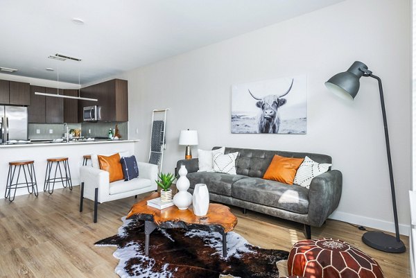 Spacious living room with contemporary furnishings at Park 40 Apartments, featuring elegant design and ample natural light