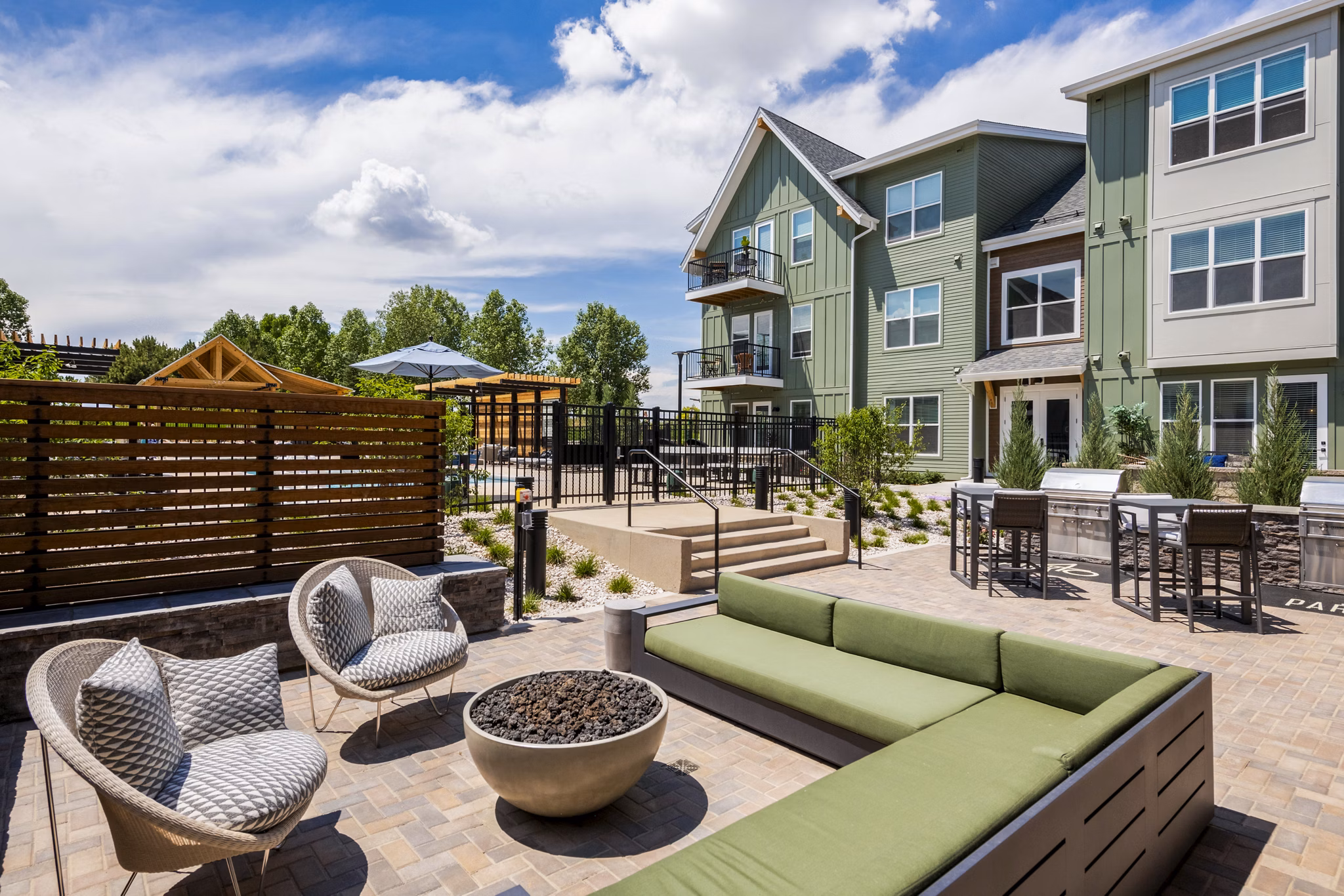 Cozy fire pit and grill area at Park 40 Apartments